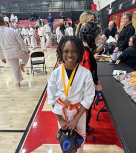 Smiling youngster in karate uniform